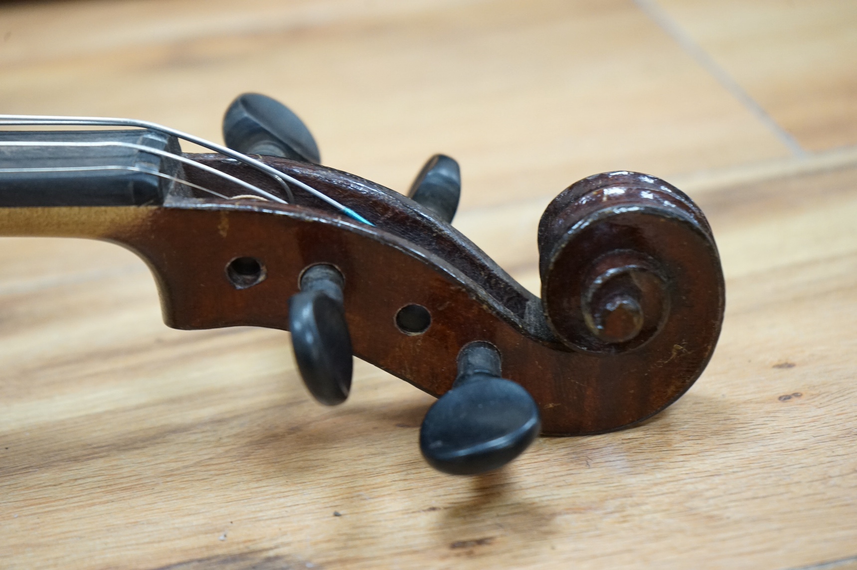 A cased violin, label to interior reads ‘Dulcis et Fortis’, back 36cm. Condition - scratches